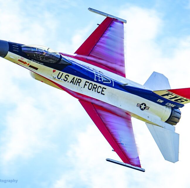 U.S. Air Force F-16 Viper in a banked pass against a blue sky